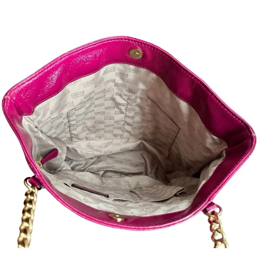 Michael Kors patent leather handbag in a sleek, glossy finish.
